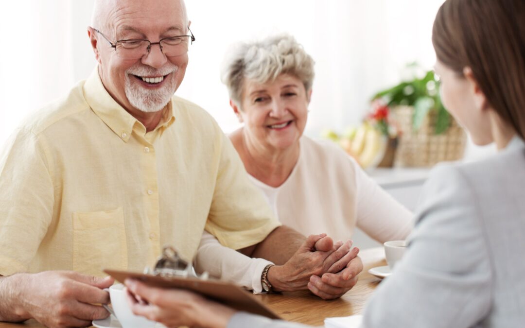 An older couple discussing their retirement savings plan with their financial advisor.